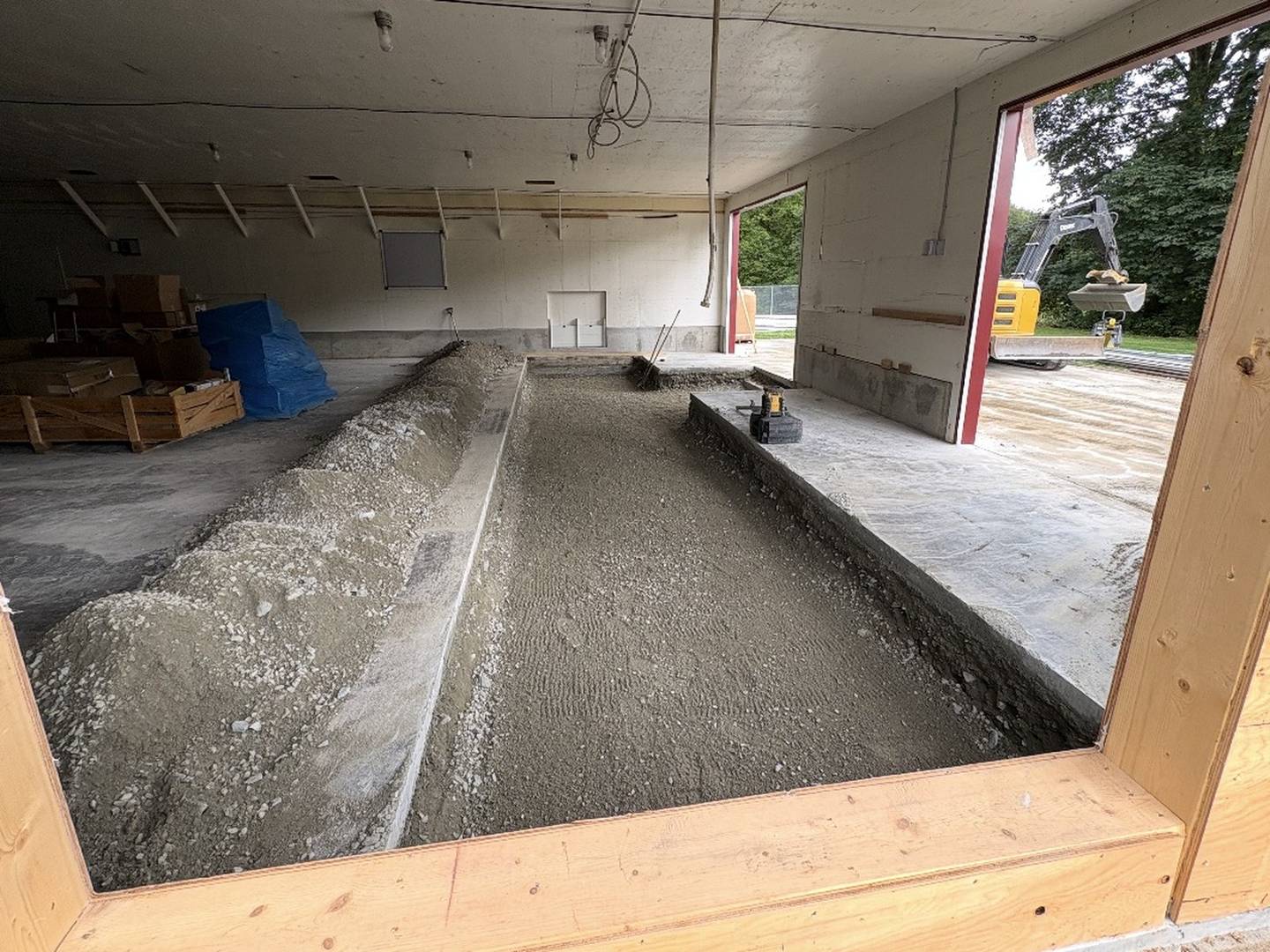 The same building with the floor opened and a new service channel formed and filled